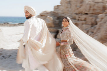 bride and groom wearing pastel Indian wedding attire