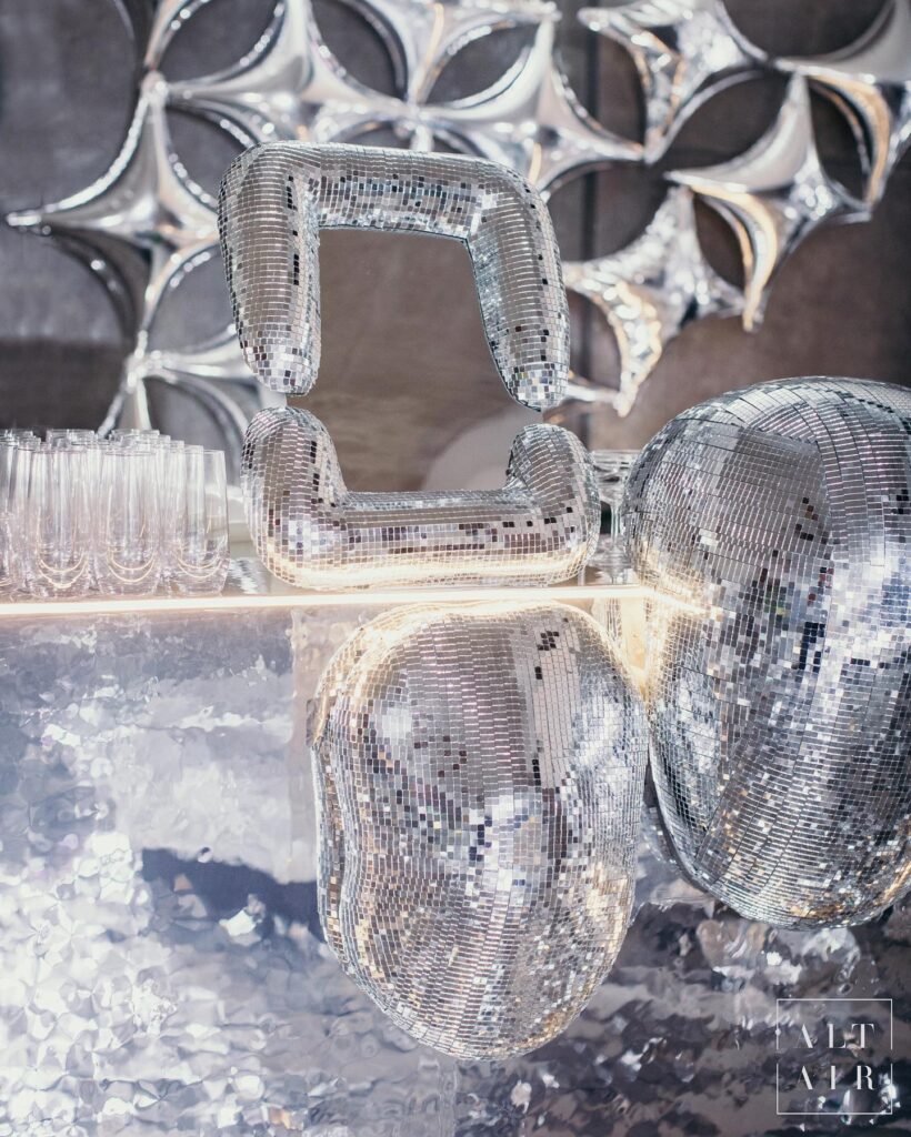 Disco ball themed cocktail décor in silver and mirrors