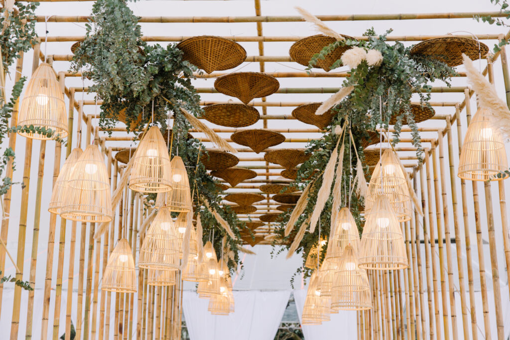 party entrance decor with bamboo lamp shades and green foliage