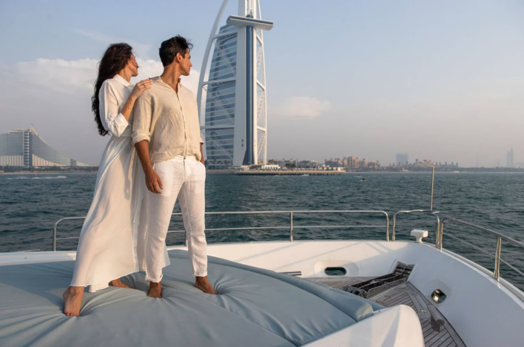 Couple on yacht wearing white in Dubai