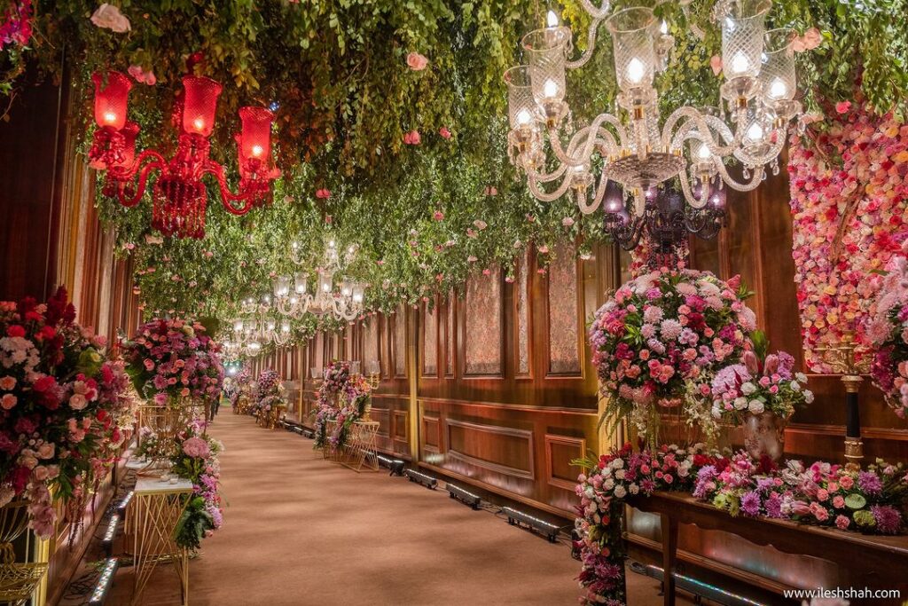 Green foliage and colourful floral arrangements with vintage chandeliers