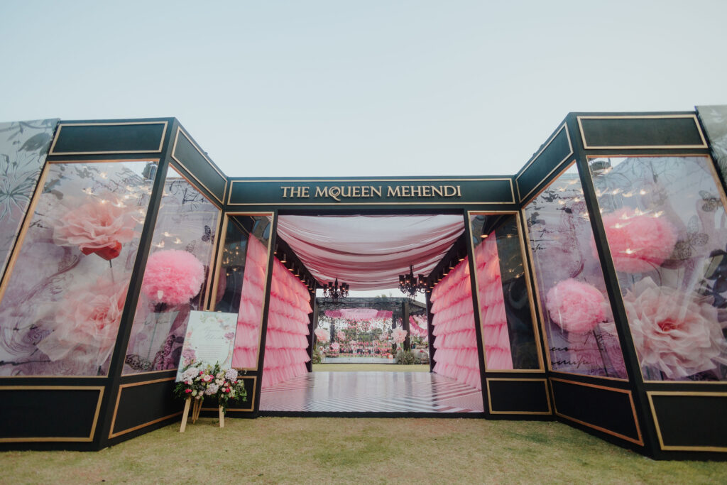 Alexander McQueen designer inspired window display decor for mehndi event with large pink flowers