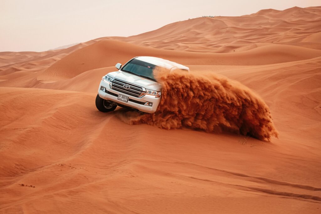 4x4 car sand surfing in Dubai desert