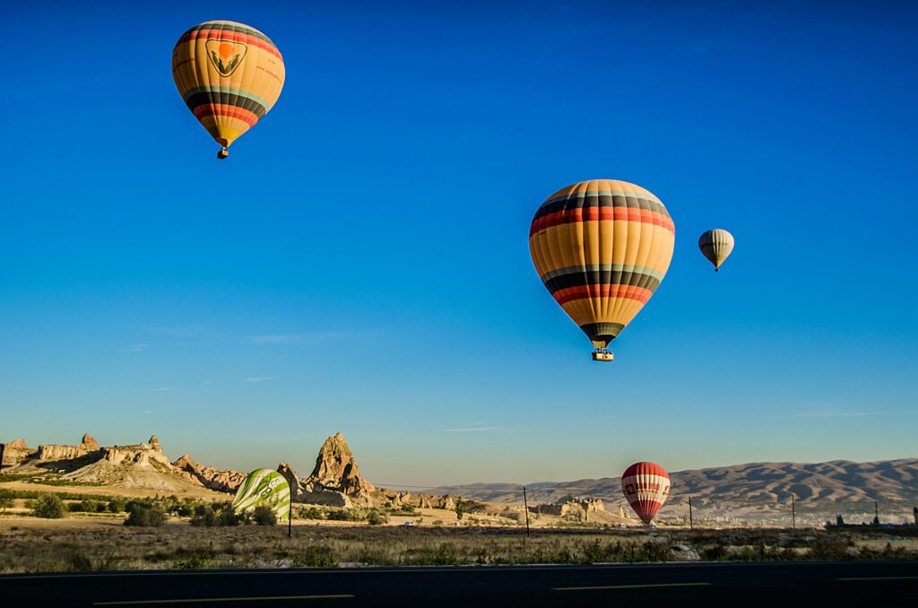 Hot air balloons in Dubai in clear blue sky