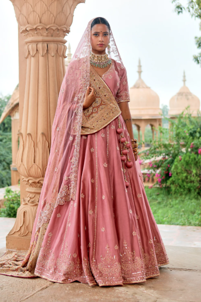 girl wearing pink wedding lehenga and jewellery