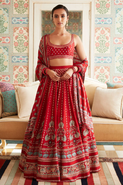 girl wearing red printed lehenga set