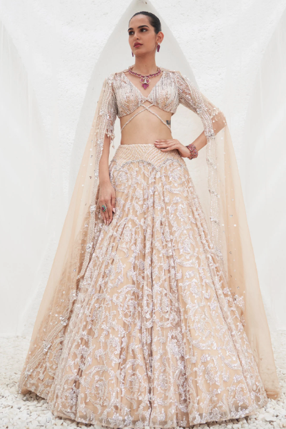 girl wearing ivory and champagne lehenga set