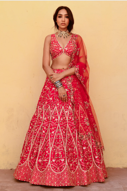 girl wearing red pink lehenga set