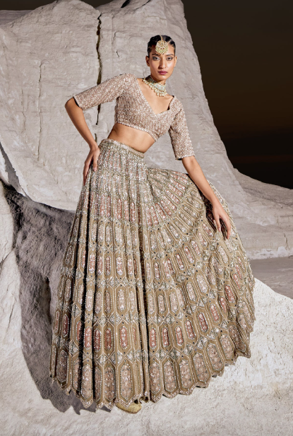 girl wearing a green embellished lehenga set