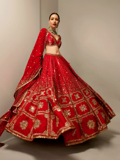 girl twirling in red sequin lehenga set