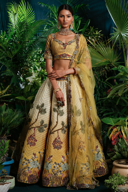 girl wearing yellow ombre lehenga set