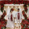 Indian bride and groom walking down the aisle